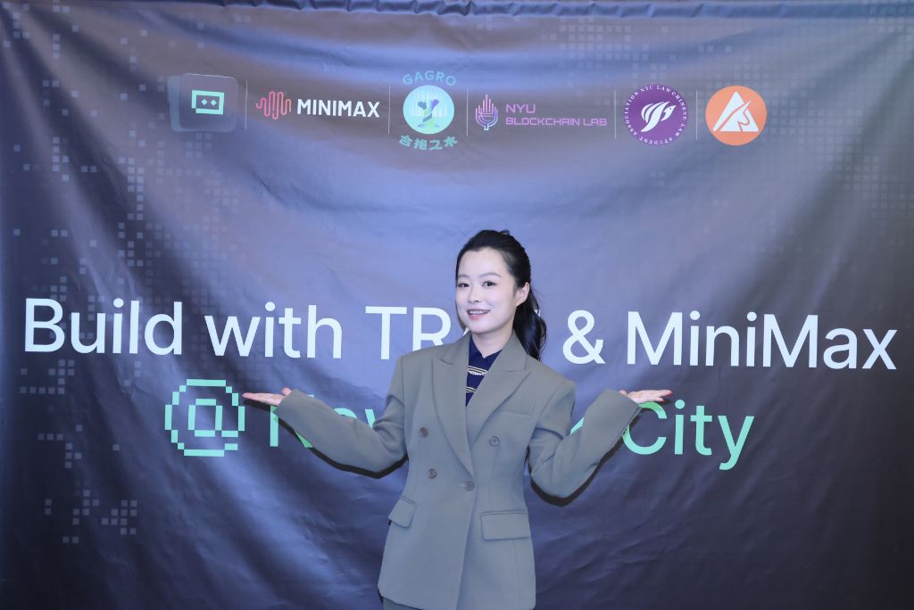 A new GaGro member celebrating in front of the Build with TRAE & MiniMax NYC banner